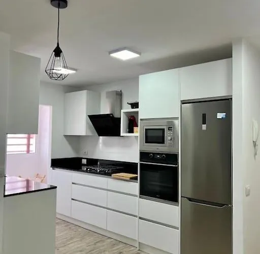 Detail Palmeras Адехе